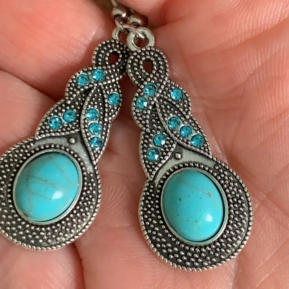 The Mavi Turquoise Blue Dangle Earrings in Silver Tone